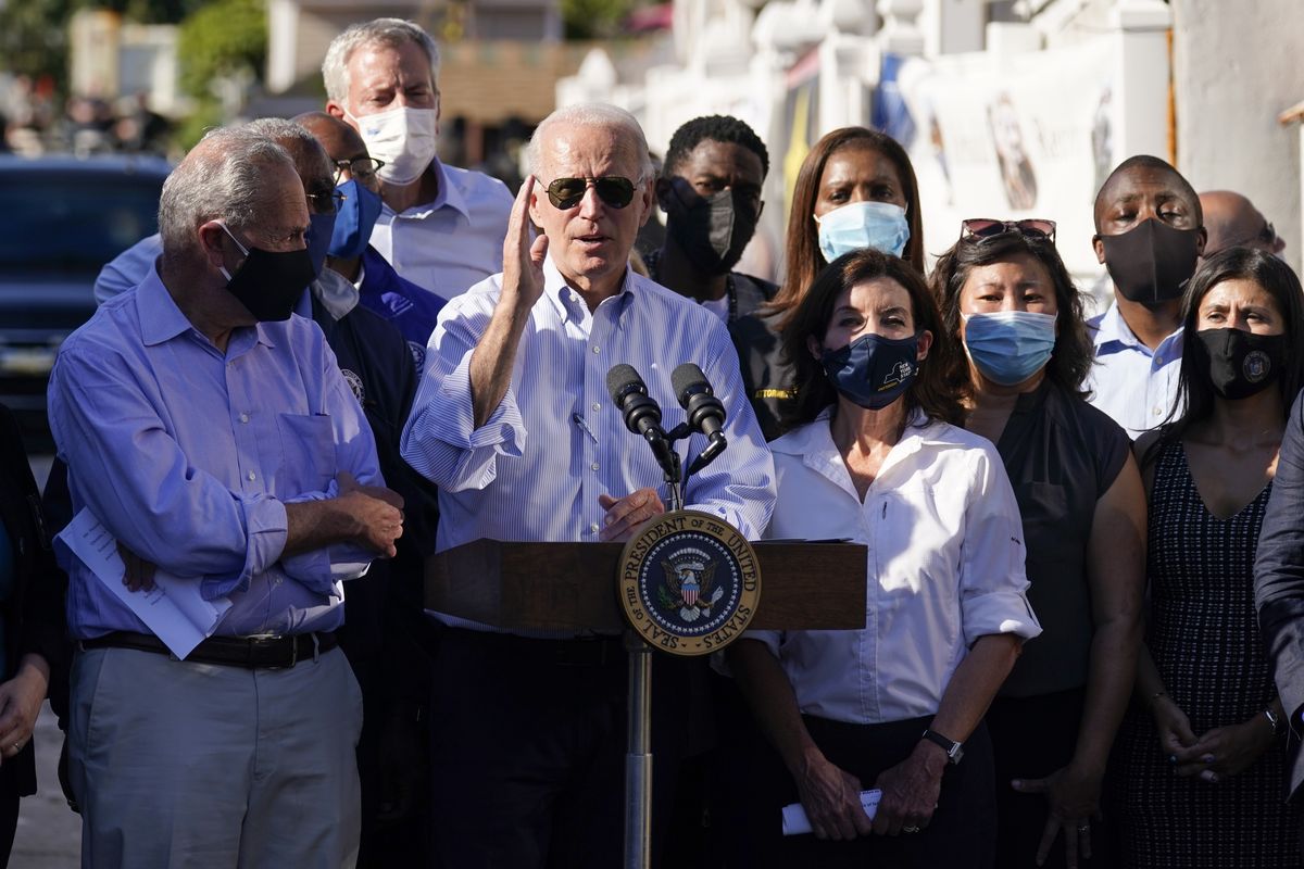 President Joe Biden speaks as he tours a neighborhood impacted by flooding from the remnants of Hurricane Ida, Tuesday, Sept. 7, 2021, in the Queens borough of New York.  (Evan Vucci)