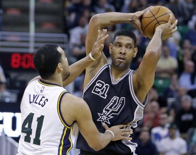 Tim Duncan, right, led the San Antonio Spurs to the playoffs in all 19 of his seasons with five of them ending in NBA championships. (Rick Bowmer / Associated Press)