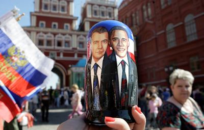 A traditional wooden doll depicting Russian President Dmitry Medvedev and President Barack Obama is held by a vendor in Moscow on Friday. (Associated Press / The Spokesman-Review)