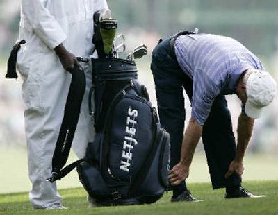 
Ben Crenshaw limbers up before teeing off during second-round play on Friday at the Masters.
 (Associated Press / The Spokesman-Review)