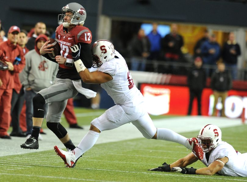 Washington State quarterback Connor Halliday is forced out of bounds against Stanford during the first half of a college football game on Saturday, September 28, 2013, at Quest Field in Seattle, Wash. Stanford led 17-3 at the half. (Tyler Tjomsland / The Spokesman-Review)