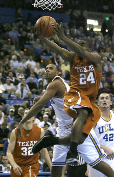 
Texas' Justin Mason (24) gets past UCLA's Josh Shipp during the Longhorns' 63-61 victory on Sunday.Associated Press
 (Associated Press / The Spokesman-Review)