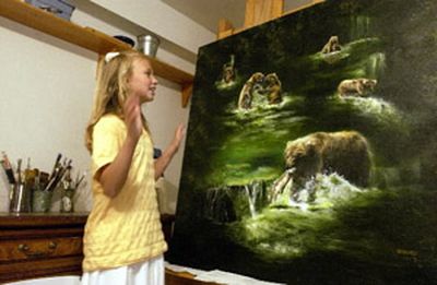
Akiane Kramarik, 10, is happy to explain the allegory behind her latest painting, where grizzly bears represent different human traits. At 10, the Post Falls homeschooler is becoming well known for her art, being profiled on Oprah and CNN. She also writes poetry, compiling a book of over 300 poems.
 (Jesse Tinsley / The Spokesman-Review)