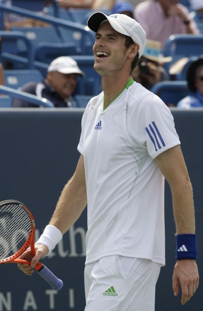 Andy Murray smiles after hitting a shot against Mardy Fish during a semifinal match Saturday at the Western & Southern Open. (Associated Press)