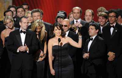 Producer, writer and star Tina Fey and cast and crew of “30 Rock” accept the Emmy award for comedy series Sunday.  (Associated Press / The Spokesman-Review)