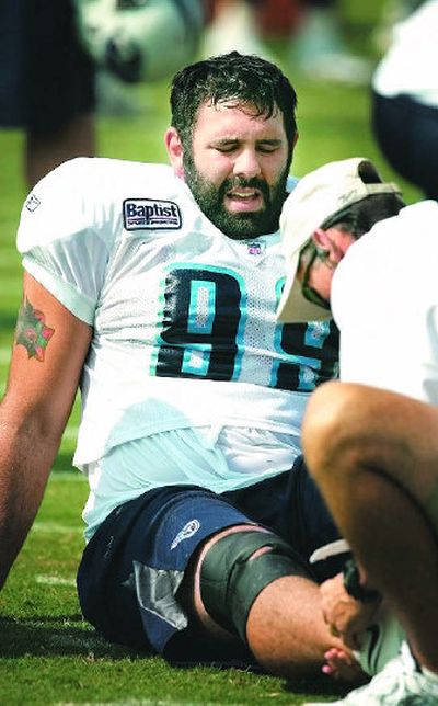 
Titans trainer Don Moseley helps  Rien Long after he injured his Achilles tendon last July. 
 (George Walker The Tennessean / The Spokesman-Review)