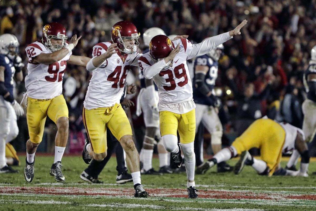 Southern California place kicker Matt Boermeester, right, celebrates after kicking the game-winning field goal against Penn State in the Rose Bowl on Monday. (Gregory Bull / Associated Press)
