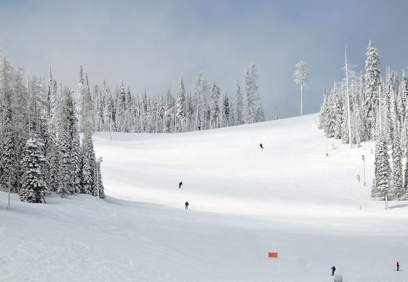 Skiers come down the Northwest Passage run, the main beginner-intermediate slope at Mt. Spokane Ski and Snowboard Park on Friday, March11, 2011.  The runs becomes a bottleneck on busy weekend days, funneling beginners and more advanced skiers into tight quarters, which is one reason the ski area would like to open the Northwest face of the mountain in a proposed expansion, adding more terrain for intermediate and advanced skiers. (Jesse Tinsley / The Spokesman-Review)