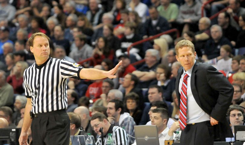 A ref puts up a warning hand to Gonzaga's Coach, Mark Few, and his assistants after a technical was called on Kelly Olynyk as the Tigers of Memphis pulled past the Bulldogs, 62-58, on Saturday, Feb. 5, 2011. (Jesse Tinsley / The Spokesman-Review)