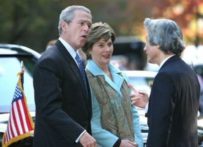 
President Bush and First Lady Laura Bush are welcomed by Japanese Prime Minister Junichiro Koizumi upon their arrival at the Kinkakuji Temple today in Kyoto, Japan.  
 (Associated Press / The Spokesman-Review)