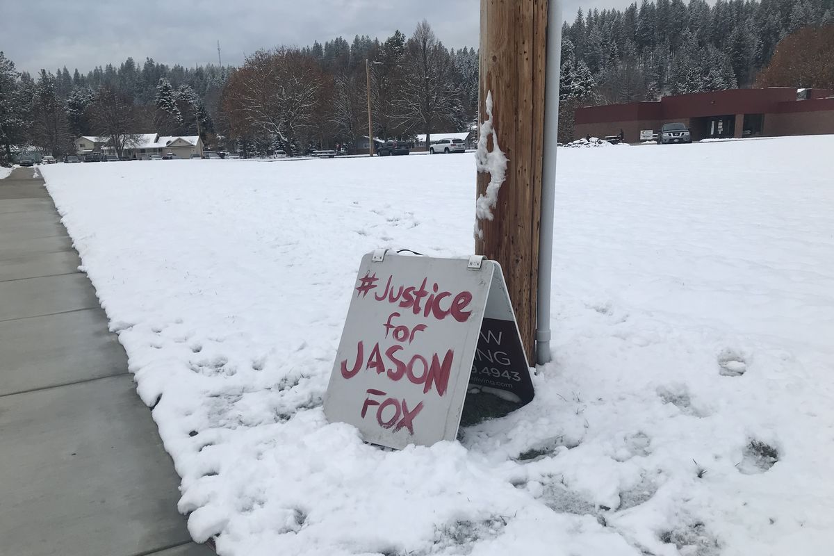 A hand-painted sign set near the Pend Oreille County courthouse calls for justice for a 19-year-old killed in Newport in September.  (Ted McDermott/The Spokesman-Review)