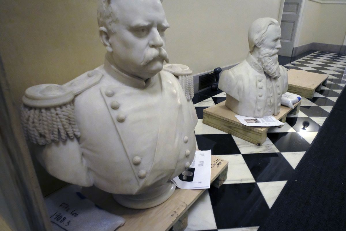 Busts of Fitzhugh Lee, left, and James E. B "Jeb" Stuart, right sit in a hallway waitng to be boxed after removal from the Old House Chamber inside the Virginia State Capitol in Richmond, Va., Thursday, July 23, 2020. All busts and plaques relating to the Confederacy were removed, including the statue of Robert E. Lee.  (Bob Brown)