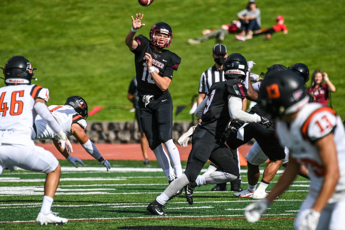 Whitworth quarterback Caleb Christensen drops a pass to running back Solomon Hines against Lewis & Clark during the second quarter of Saturday’s Northwest Conference game.  (DAN PELLE/THE SPOKESMAN-REVIEW)
