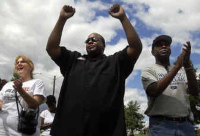 
Kenneth Andrews, center, dances and cheers for the Bethel AME Choir on Saturday at Liberty Park during the Unity in the Community event. Andrews performed 