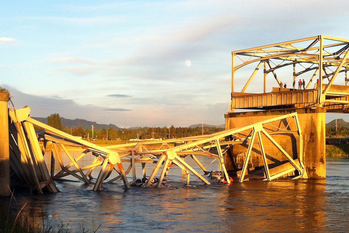 A portion of a four-lane Interstate 5 bridge is submerged after it collapsed into the Skagit River on Thursday evening, dumping vehicles and people into the water near Mount Vernon, Wash. The bridge is about 60 miles north of Seattle in Skagit County. (Associated Press)