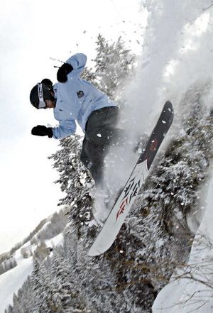 
Chris Klug enjoys some of the snowfall Aspen's received lately as he rides his board through the powder earlier this week. Aspen has recorded more than 21 feet of snow this season with many longtime residents saying it's the best they have ever seen. 
 (Associated Press / The Spokesman-Review)