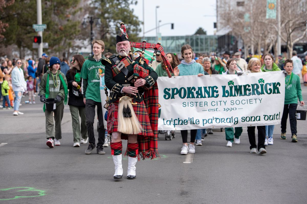 Piper William Clark leads the Spokane Limerick Sister City Society in the annual St. Patrick
