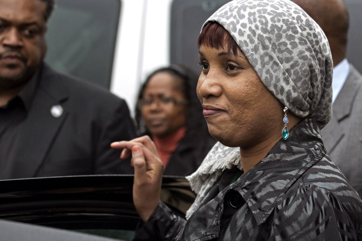 Nafissatou Diallo, who claims she was sexually assaulted by Dominique Strauss-Kahn, enters a car outside a Bronx courthouse after the case was settled Monday in New York. (Associated Press)