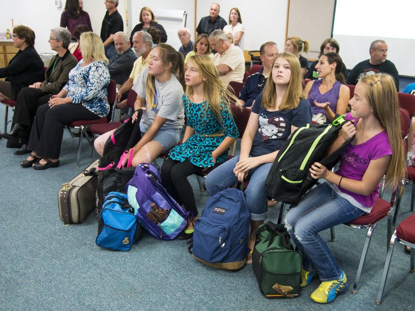 East Farms STEAM Magnet School students attended the East Valley School Board meeting Sept. 10 with their heavy backpacks in tow to advocate for lockers at their school. From left: Marena Stewart, 12, Tizara Belback, 12, Riley Wallwork, 11, and Shontelle Belback, 12. (Colin Mulvany)