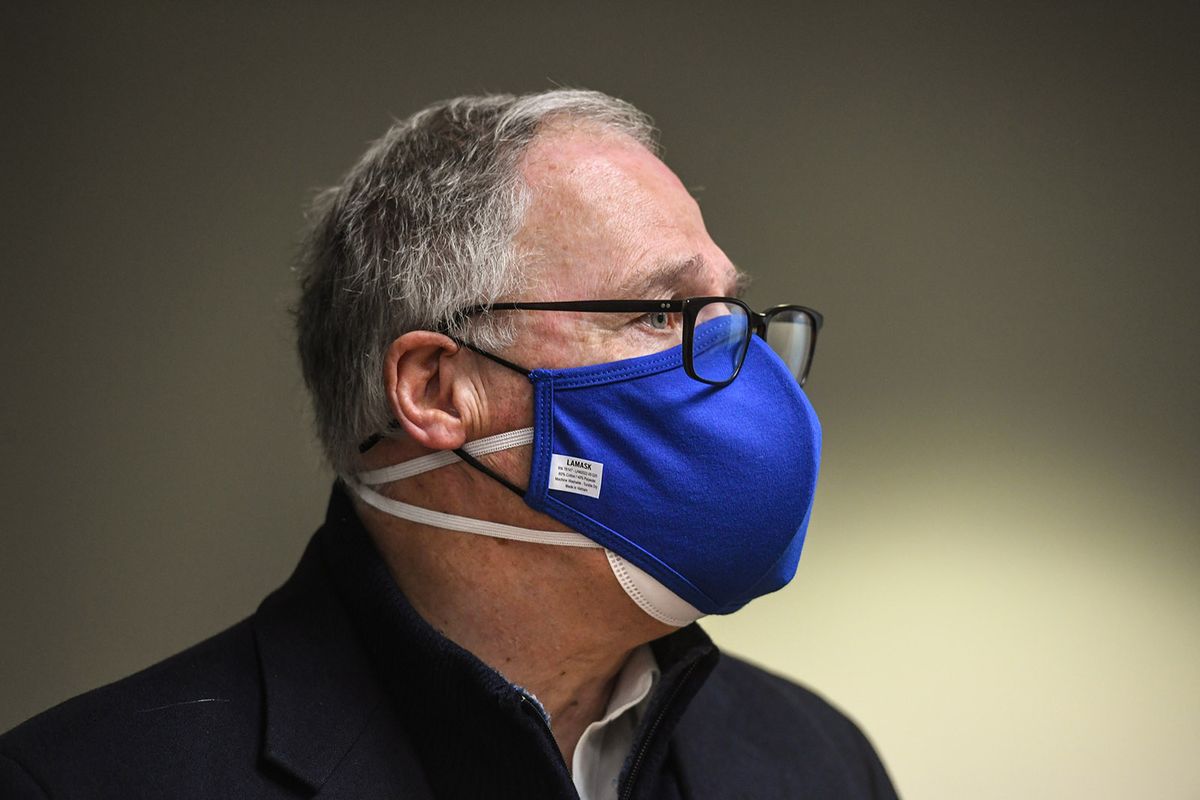 Gov. Jay Inslee talks with the media after his tour of Stevens Elementary School, Feb. 23, 2021, in Spokane.  (DAN PELLE/THE SPOKESMAN-REVIEW)