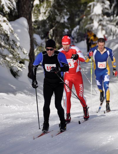 Brad Bauer of Seattle, middle, bides his time behind James Rucker of Whitefish, Mont., in the first few minutes of the 35th annnual Spokane Langlauf 10-kilometer cross-country ski race at Mount Spokane State Park. Bauer, 39, soon broke away to win the 10-kilometer classic event in 26:19, four minutes ahead of second-place Rucker and the field of 244 racers. Deb Bauer of Spokane led the women in 32:20, beating runner-up Grace Ford of Spokane. See results on page B4 and a photo gallery from the race online at www.spokesman.com/ blogs/outdoors. (Rich Landers)