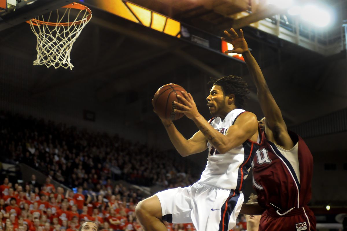 Trailed by LMU’s Vernon Teel, Gonzaga’s Steven Gray goes  to the basket on a fast break in the first half of Saturday’s game. (Jesse Tinsley / The Spokesman-Review)