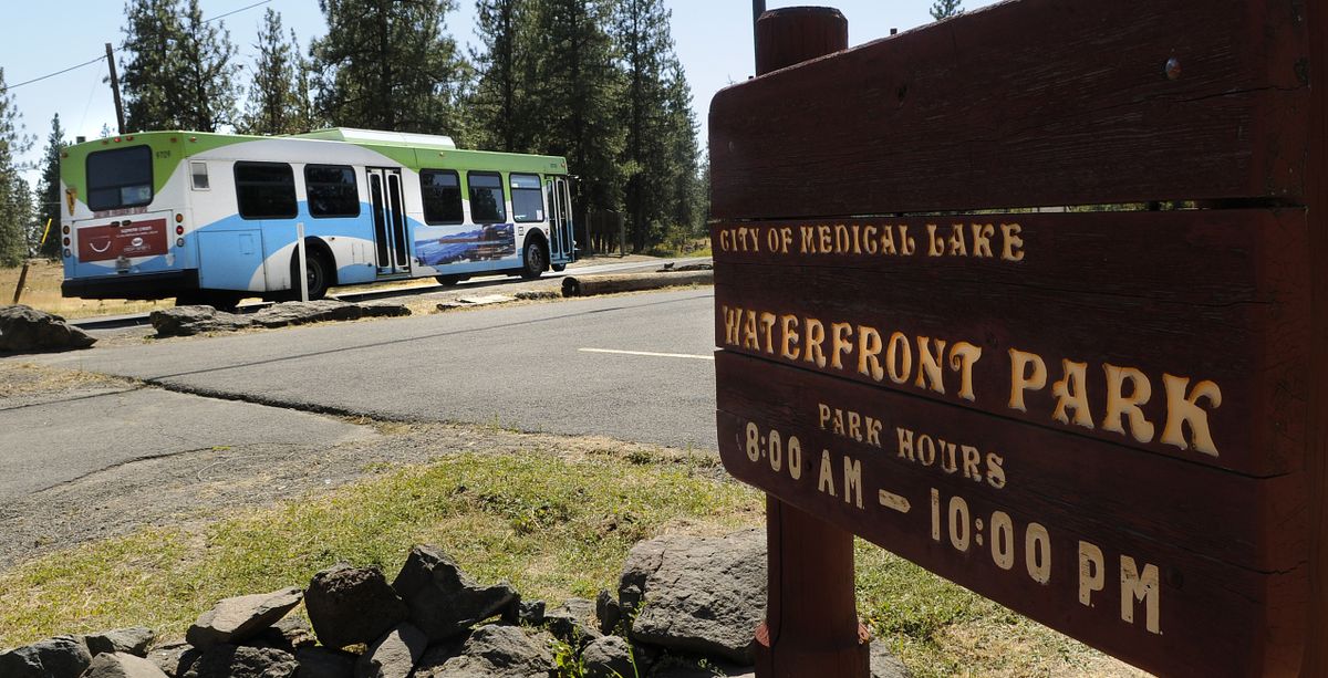 An STA bus travels its route past Medical Lake and Waterfront Park.  (Dan Pelle / The Spokesman-Review)