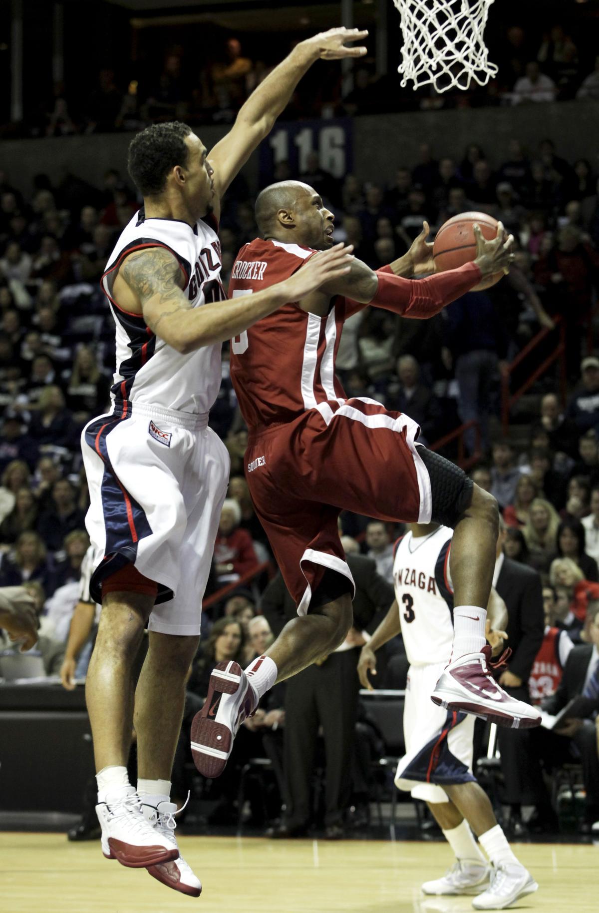 Oklahoma’s Tony Crocker shoots as Gonzaga’s Robert Sacre defends in the first half Thursday at the Arena. (Rajah Bose Associated Press)