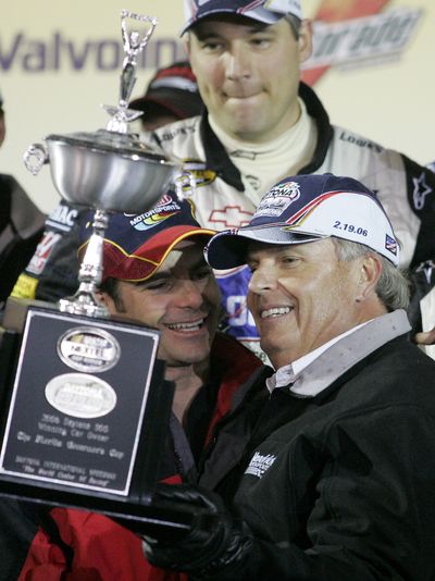 Rick Hendrick (holding trophy) has celebrated 175 victories in 25 years as an owner.  (Associated Press / The Spokesman-Review)