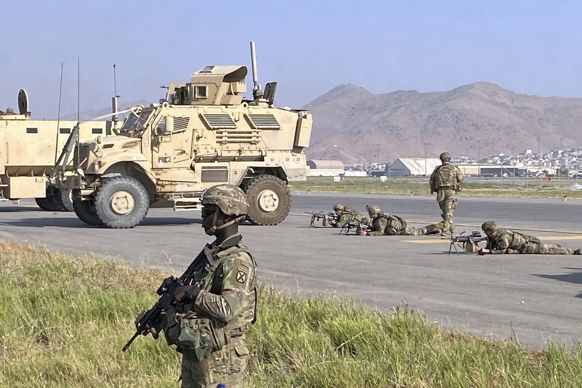U.S soldiers stand guard along a perimeter at the international airport in Kabul, Afghanistan, Monday, Aug. 16, 2021. On Monday, the U.S. military and officials focus was on Kabul