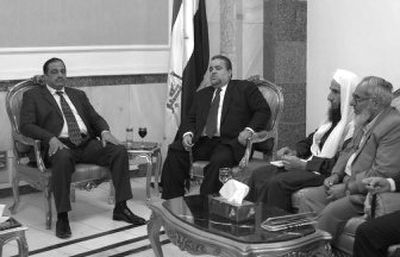 
Iraq's parliament speaker Hajim al-Hassani, center left, meets with Sunni negotiators, from left, Saad Asim al-Janabi, Abdul Nasir al-Janabi and Fakhri al-Kaysi in Baghdad on Saturday.
 (Associated Press / The Spokesman-Review)