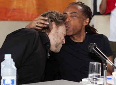 
Brazilian pop superstar and Minister of Culture Gilberto Gil kisses Grateful Dead lyricist John Barlow on Saturday during the World Social Forum.
 (Associated Press / The Spokesman-Review)