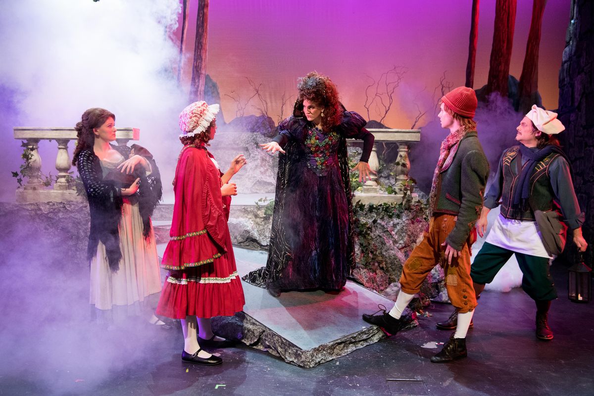 Andrea Olsen, center, playing the part of The Witch, acts out a scene from the Spokane Valley Summer Theatre’s musical “Into the Woods” with, from left: Callie McKinney Cabe, playing the Baker’s Wife; Noelle Fries, playing Little Red Ridinghood; Kyle Adams, playing Jack; and Michael J. Muzatko. (Tyler Tjomsland / The Spokesman-Review)