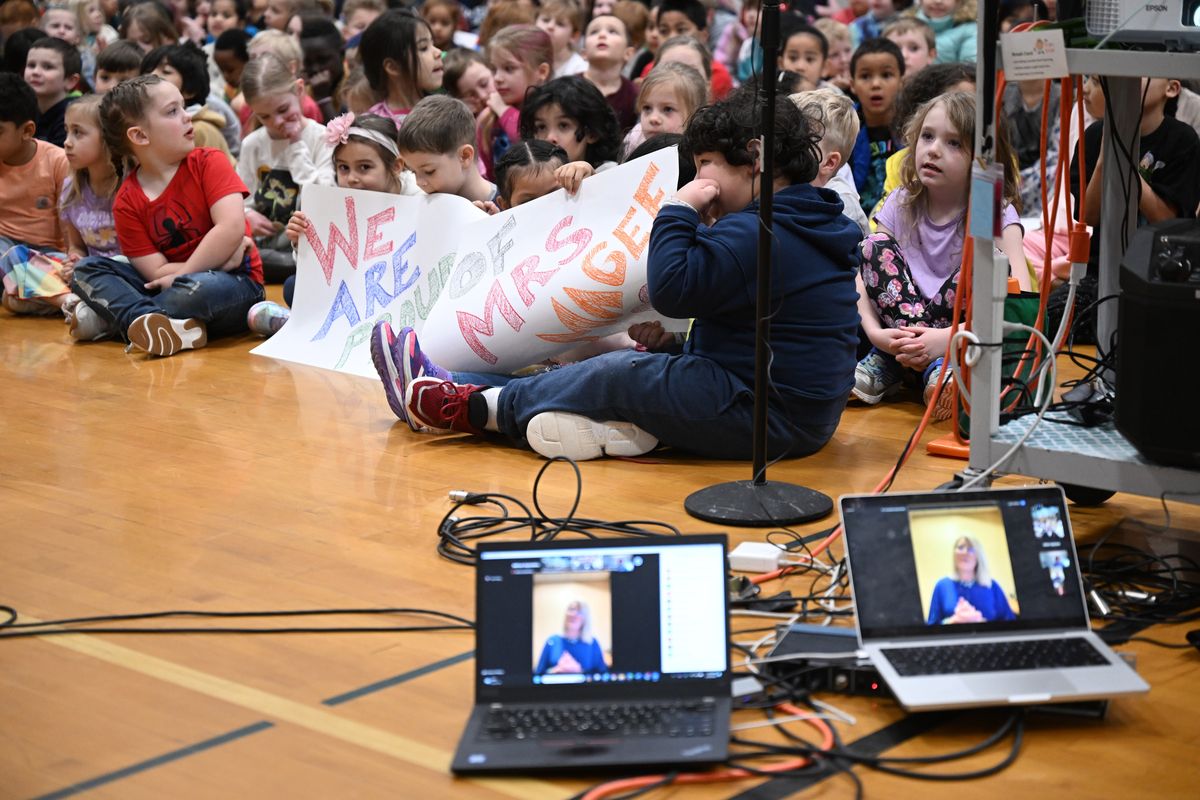 The kids at Stevens Elementary listen as school counselor Fondra Magee, seen on laptop on a Zoom call, thanks the state professional organization for awarding her the Washington State School Counselor of the Year award Wednesday during an assembly at the school in Spokane.  (Jesse Tinsley/THE SPOKESMAN-REVIEW)