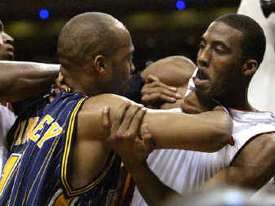 
Miami Heat's Eddie Jones, right, and Indiana Pacers' Jamaal Tinsley get into a scuffle during the fourth quarter. Miami Heat's Eddie Jones, right, and Indiana Pacers' Jamaal Tinsley get into a scuffle during the fourth quarter. 
 (APAP / The Spokesman-Review)