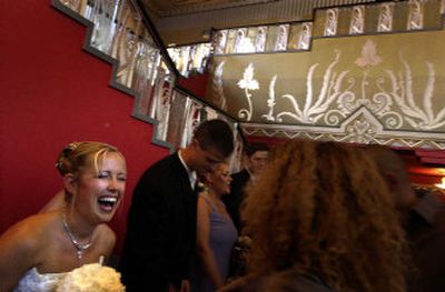 
Newlywed Nyla Beck Pipes shares a laugh with a guest after her wedding at the Fox Theater on Saturday. 
 (Jed Conklin / The Spokesman-Review)