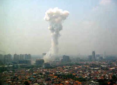 
Smoke billows following a powerful car bomb outside the Australian Embassy on Thursday in Jakarta, Indonesia 
 (Associated Press / The Spokesman-Review)