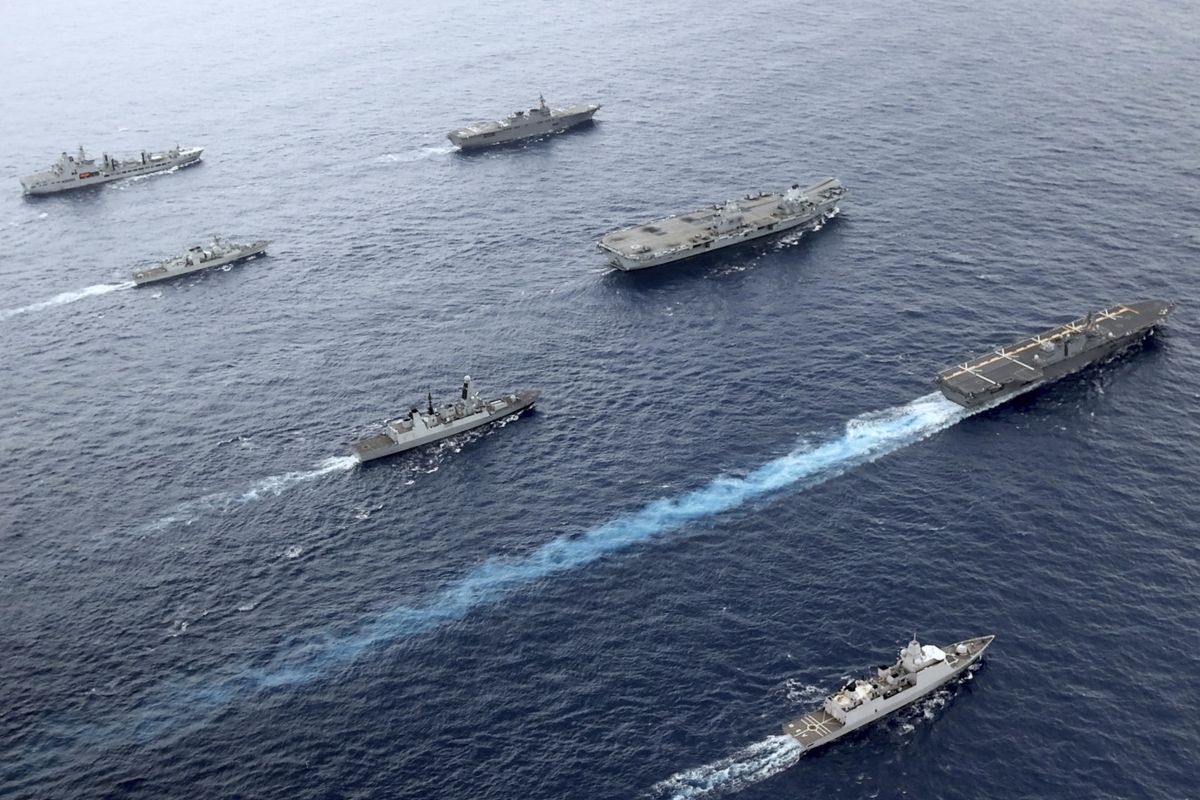 Front to back; HNLMS Evertsen, JS Izumo, HMS Defender, HMS Queen Elizabeth, HMCS Winnipeg, JS Ise, RFA Tidespring. UK Royal Navy Carrier Strike Group 21 HMS Queen Elizabeth, HMS Defender, RFA Tidespring and HNLMS Evertsen from CSG21 sails with Japanese ships JS Izumo and JS Ise along with the Canadian ship HMCS Winnipeg in the Pacific Ocean, Sept. 2021. With increasingly strong talk in support of Taiwan, a new deal to supply Australia with nuclear submarines, and the launch of a European strategy for greater engagement in the Indo-Pacific, the U.S. and its allies are becoming growingly assertive in their approach toward a rising China.  (Jay Allen)