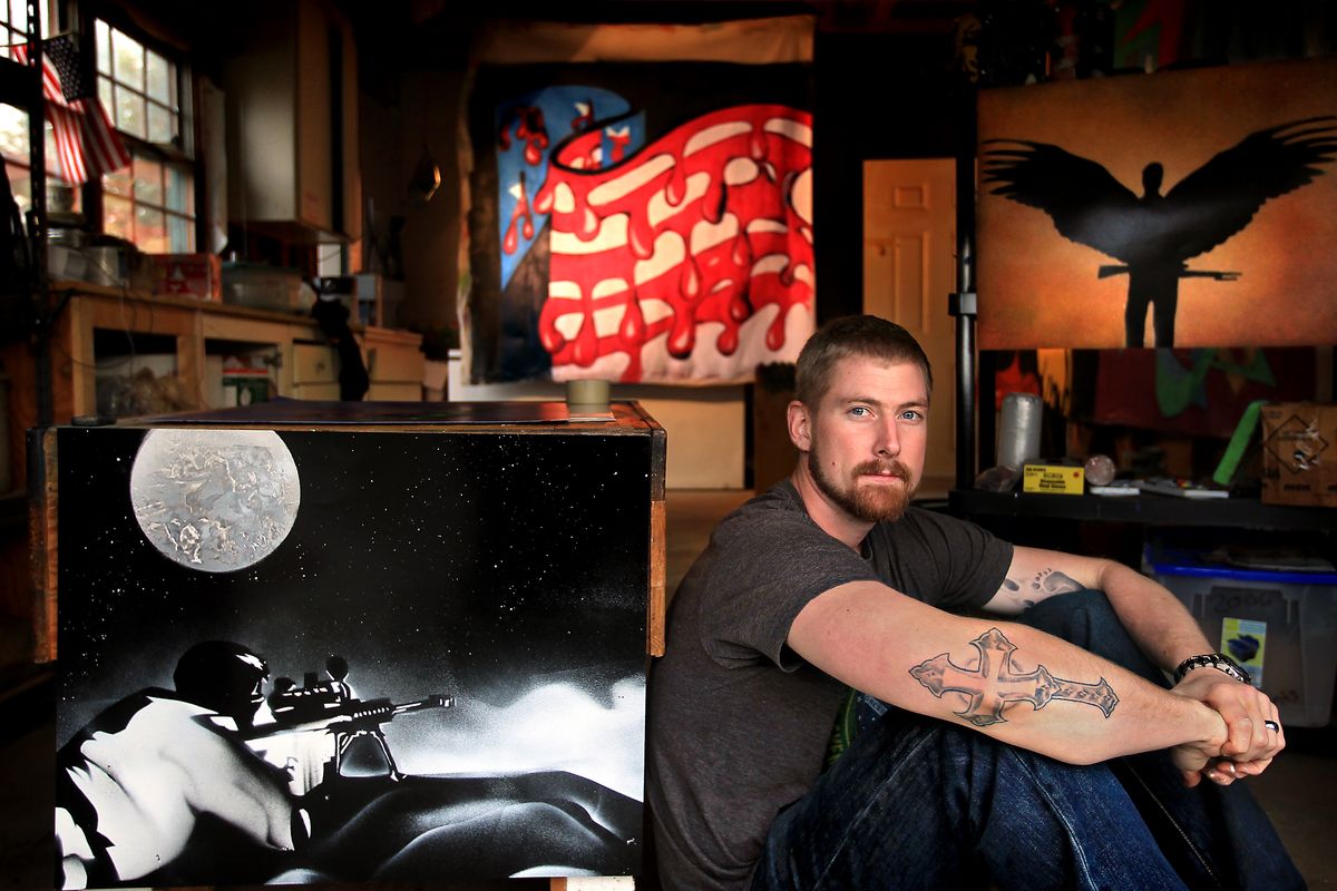 Stephen Ewens, of Gig Harbor, displays some of his artwork. He enlisted in the military in 2006 four weeks after his brother Lt. Forrest Ewens was killed in Afghanistan. (Associated Press)