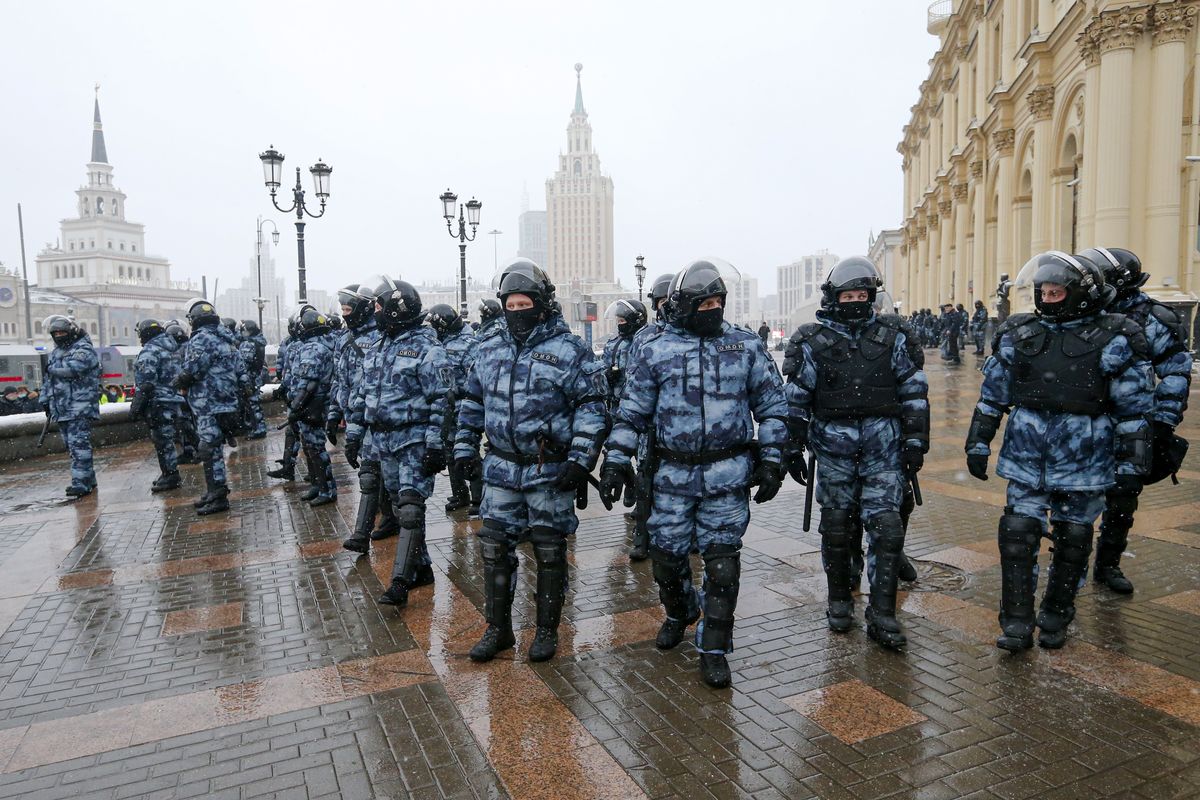 Riot police block an area protecting against demonstrators during a protest against the jailing of opposition leader Alexei Navalny in Moscow, Russia, Sunday, Jan. 31, 2021. Thousands of people took to the streets Sunday across Russia to demand the release of jailed opposition leader Alexei Navalny, keeping up the wave of nationwide protests that have rattled the Kremlin. Hundreds were detained by police.  (Alexander Zemlianichenko)