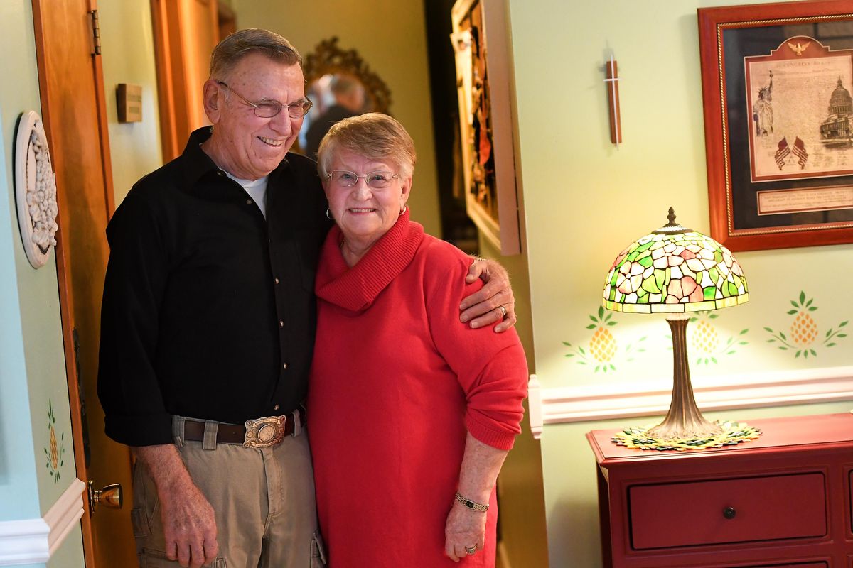 Ray Kuhn smiles as he puts his arm around his wife, Donna Kuhn, as they are photographed Thursday, Feb. 6, 2020, at their home in Spokane, Wash. (Tyler Tjomsland / The Spokesman-Review)
