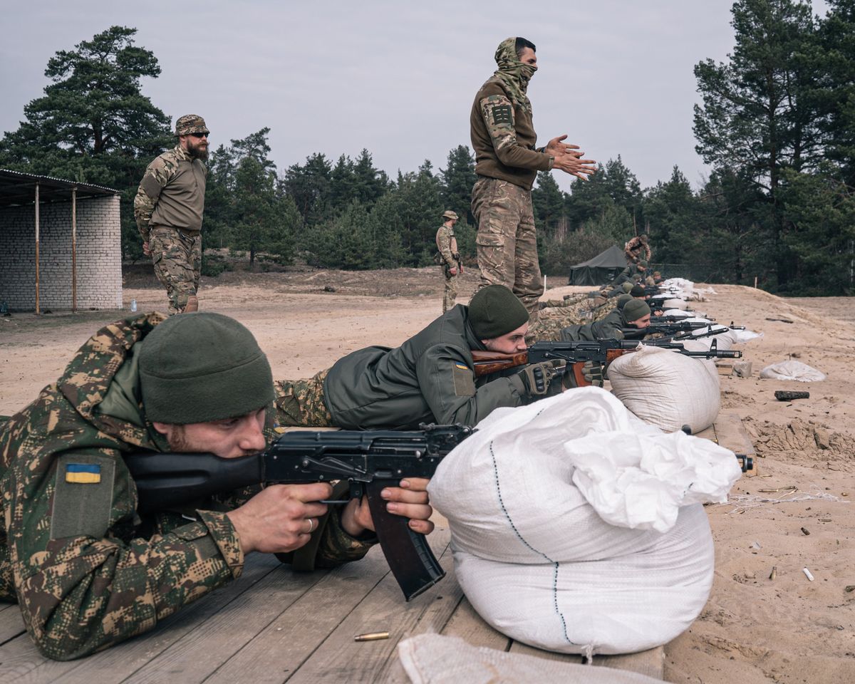 Recruits practice shooting at an Azov brigade training camp on March 24 outside Kyiv, Ukraine.  (Photo for The Washington Post by Alice Martins.)