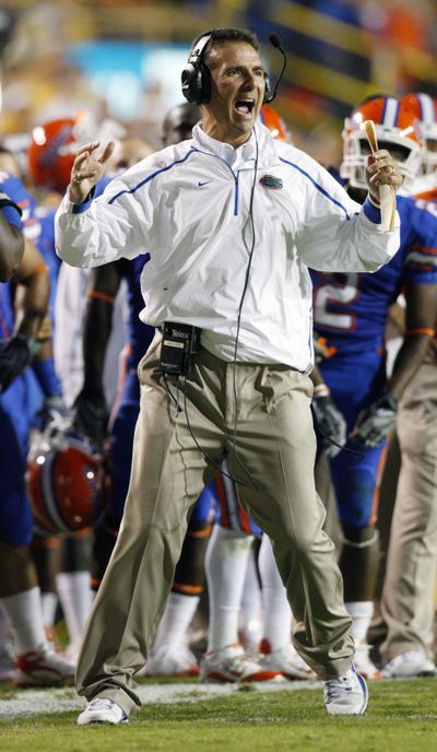 Florida coach Urban Meyer says he will remain in Gainesville.  (Associated Press)