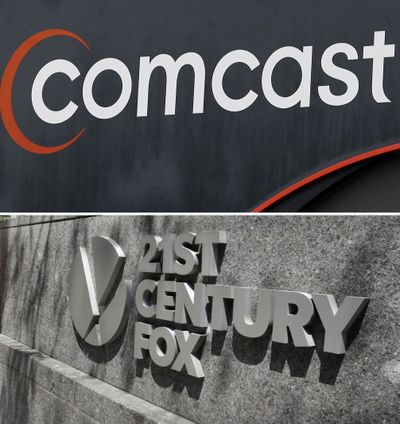 This combo of file photos shows the 21st Century Fox sign outside of the News Corporation headquarters building in New York, bottom, and a Comcast sign in Hialeah, Fla. (Alan Diaz, top, Richard Drew, bottom / Associated Press)