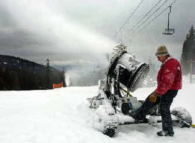Colin Richardson checks on one of the two snowmaking machines positioned on Musical Chairs, the popular beginner run, Thursday morning at Schweitzer Mountain Resort. A lack of snowfall has forced them to try and make snow, which only works when the temperature is under 24 degrees (approximately).
(Jesse Tinsley / The Spokesman-Review)
