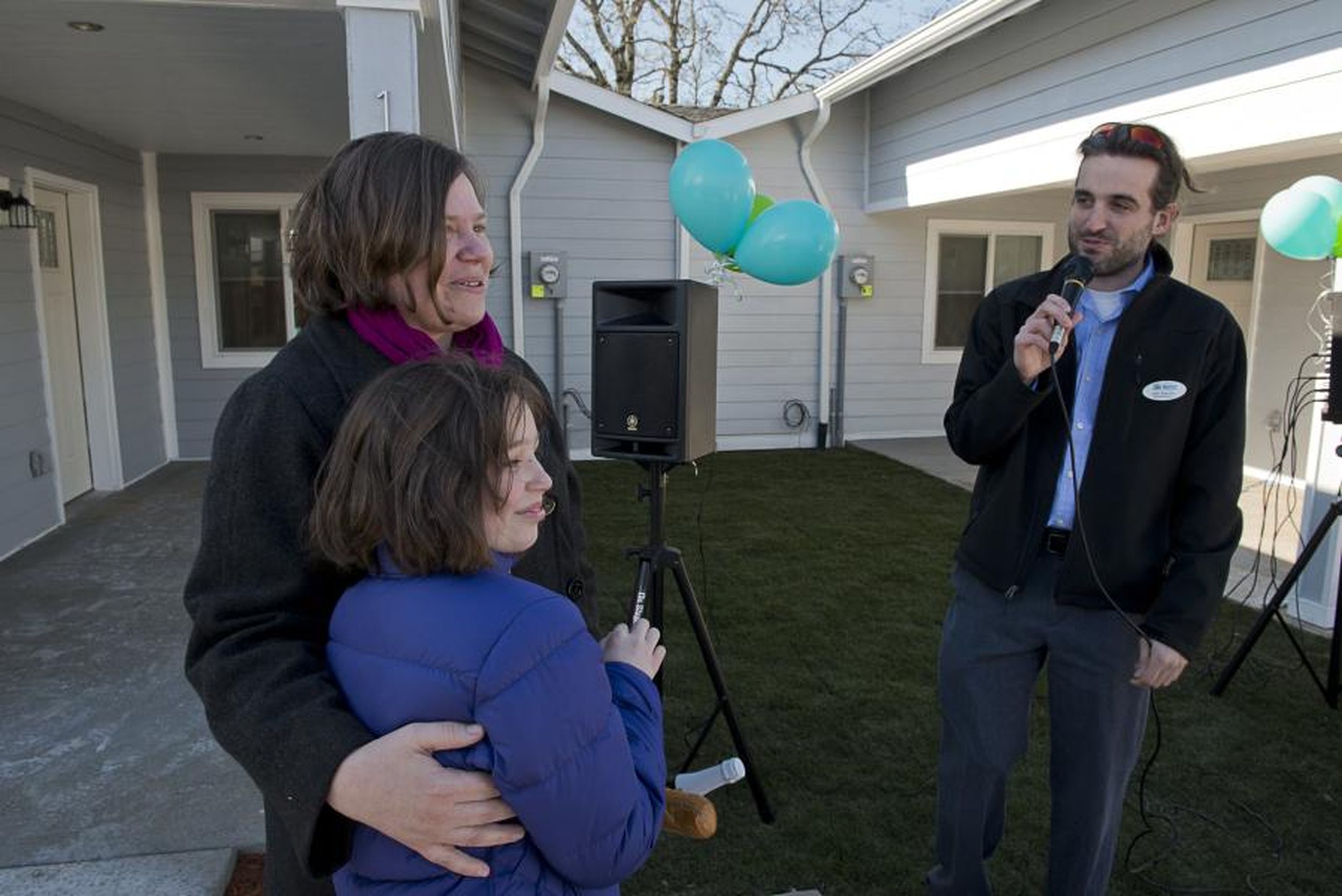 Evergreen Habitat for Humanity dedicates conjoined homes to single