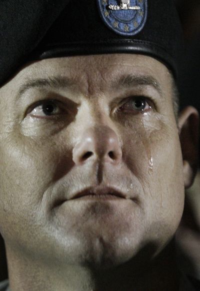 ORG XMIT: TXMO127 A tear runs down the face of Col. William Salter during a vigil at Fort Hood, Texas on Friday, Nov. 6, 2009. Authorities said Maj. Nidal Malik Hasan shot and killed 13 people at Fort Hood, Texas on Thursday. (AP Photo/LM Otero) (Lm Otero / The Spokesman-Review)