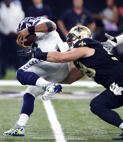 New Orleans Saints defensive end Paul Kruger sacks Seattle Seahawks quarterback Russell Wilson in the first half of an NFL football game in New Orleans, Sunday, Oct. 30, 2016. (Butch Dill / Associated Press)
