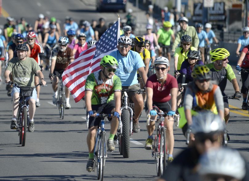 Several hundred cyclists depart from Kendall Yards and across the Monroe Street Bridge Sunday, Sept. 11, 2016 while participating in Spokefest, an annual festival of cycling which includes non-competitive group rides of 9, 21, or 50 miles. The riders left and returned to Kendall Yards for the first time. The event began in 2008. (Jesse Tinsley / The Spokesman-Review)