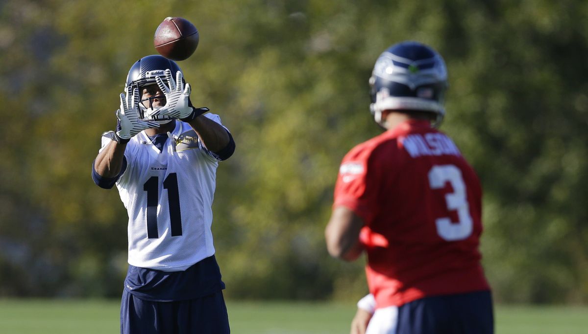 Seattle’s Percy Harvin, left, and Russell Wilson may be hooking up for some big plays soon. (Associated Press)